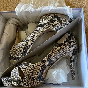 Size 8 Marc Fisher snake skin peep toe sandals. New in the box never worn.